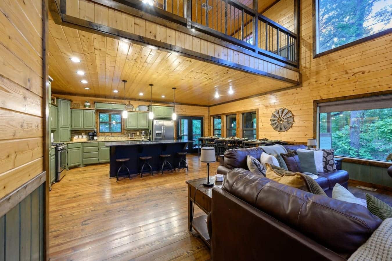 This open-concept setup is basically a master class in how to throw everyone together in one giant room and somehow make it feel like you're each doing your own thing.