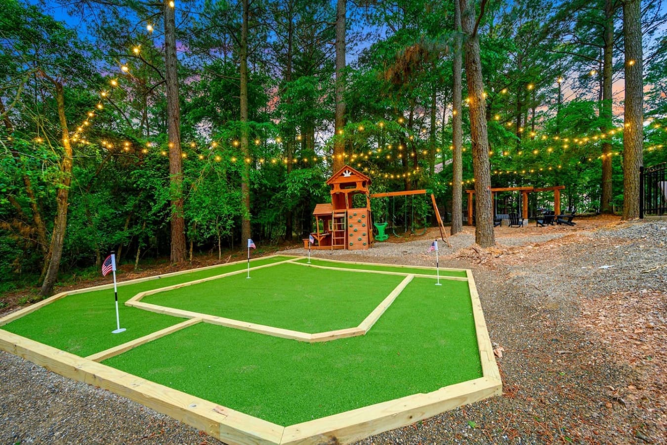 Got a mini golf course right in the backyard, complete with twinkling lights overhead and enough space for the whole crew to spread out.