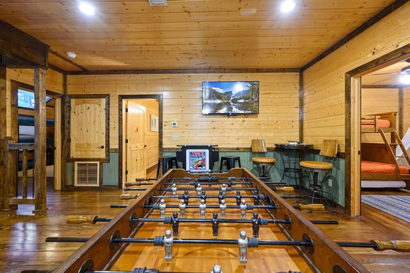 If you've got a competitive group, this foosball table and arcade setup will keep everyone entertained for hours without anyone having to leave the room.