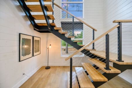 Where modern design meets cabin warmth — this staircase is more than a pathway, it’s a statement.