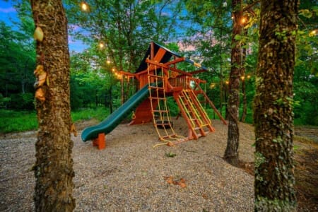 A backyard playground where imaginations climb, slide, and swing wild and free.