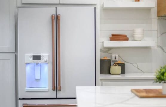 Minimalist shelving, earthy accents, and a fridge that fits right in.