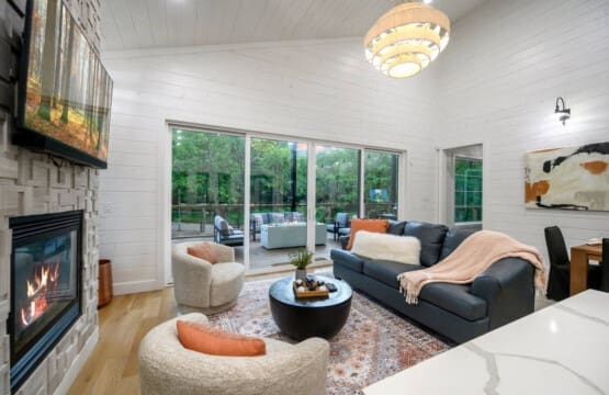Wake up with the trees, wind down by the fire—this living room was made for slow moments and scenic views.