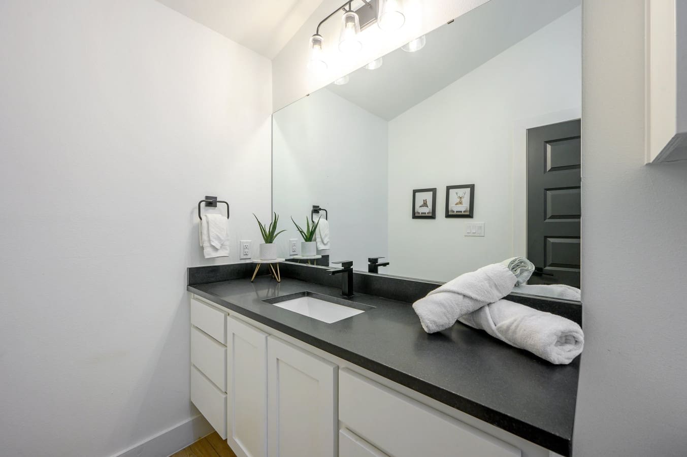 Modern touches meet cabin charm in this stylish bathroom retreat.