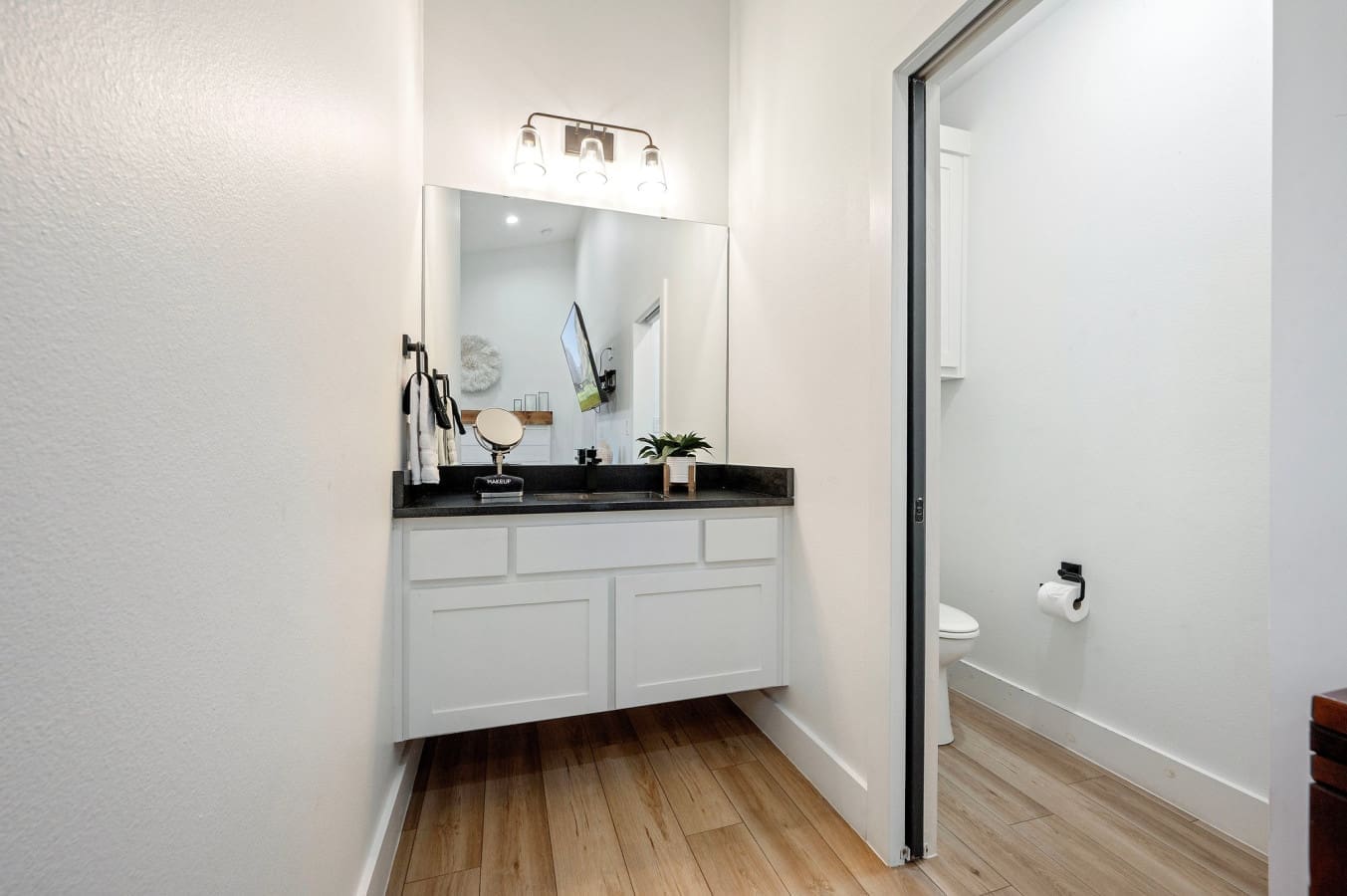 This bright and modern vanity space is all about calm, comfort, and convenience.