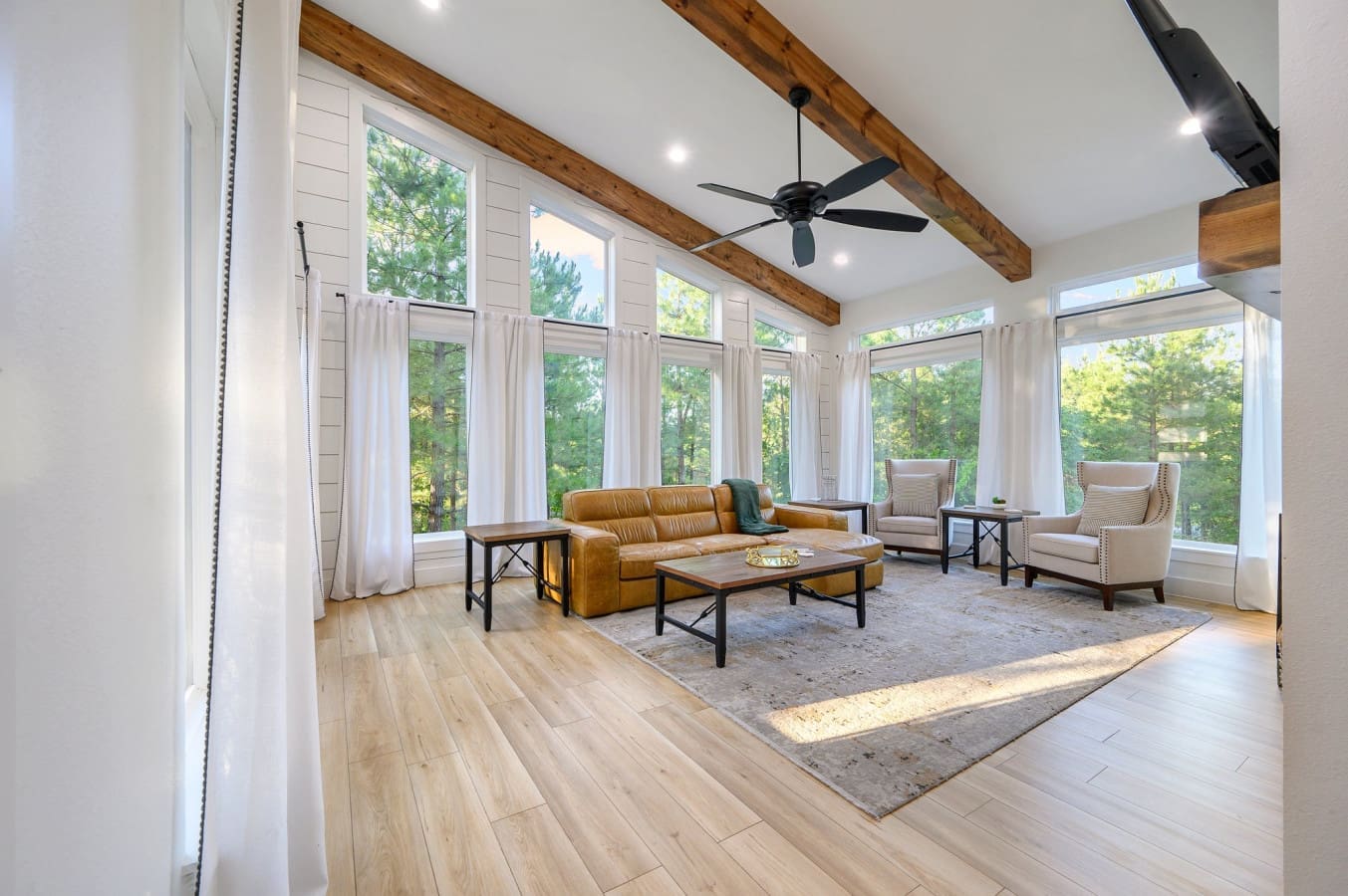 Soaring windows, forest views, and cozy vibes