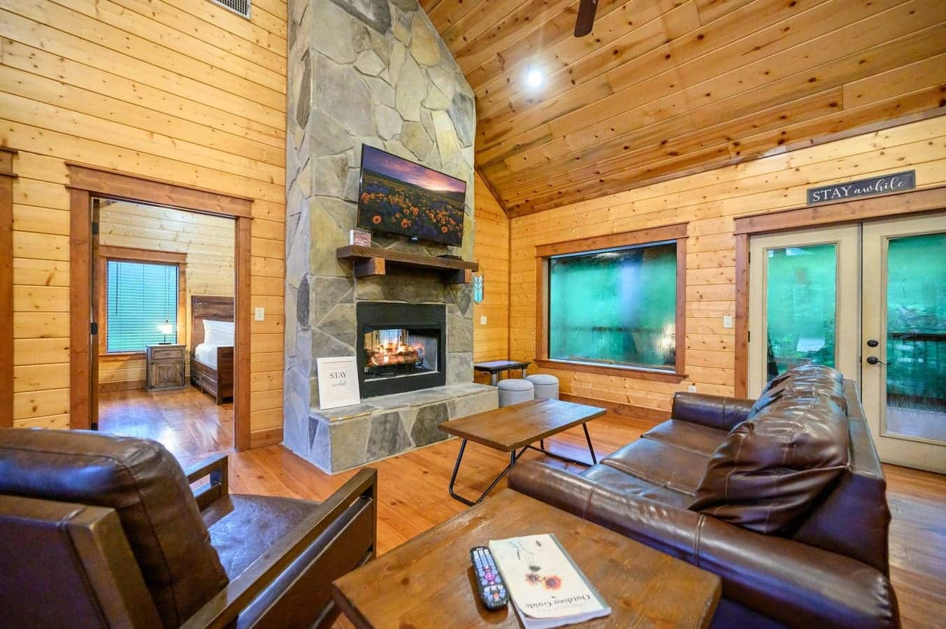 Cozy up in the living room by the warm glow of the fireplace.