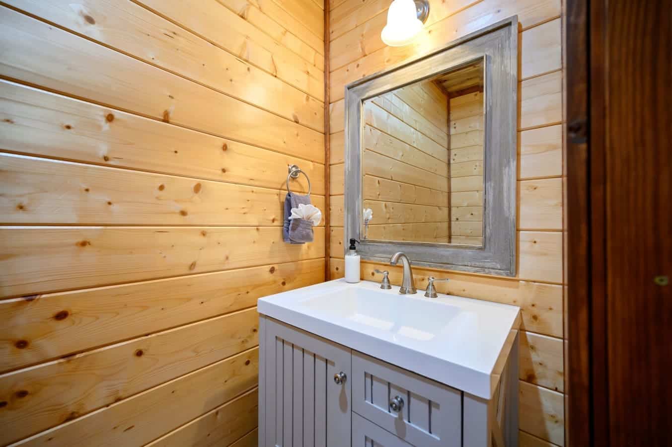 Clean and modern half bathroom near the living area.