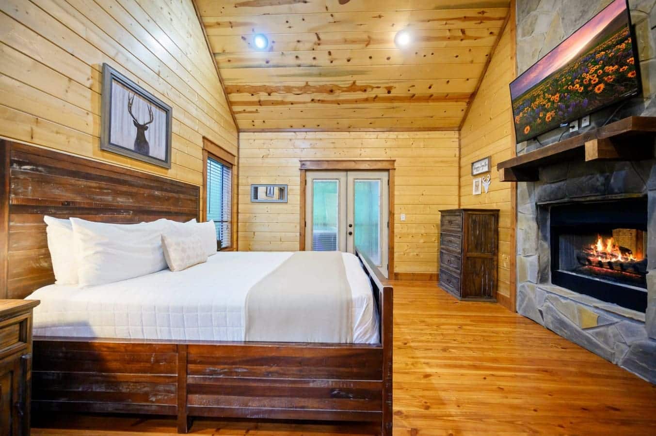 Plush bedding, cozy lighting, and cabin charm in every room.