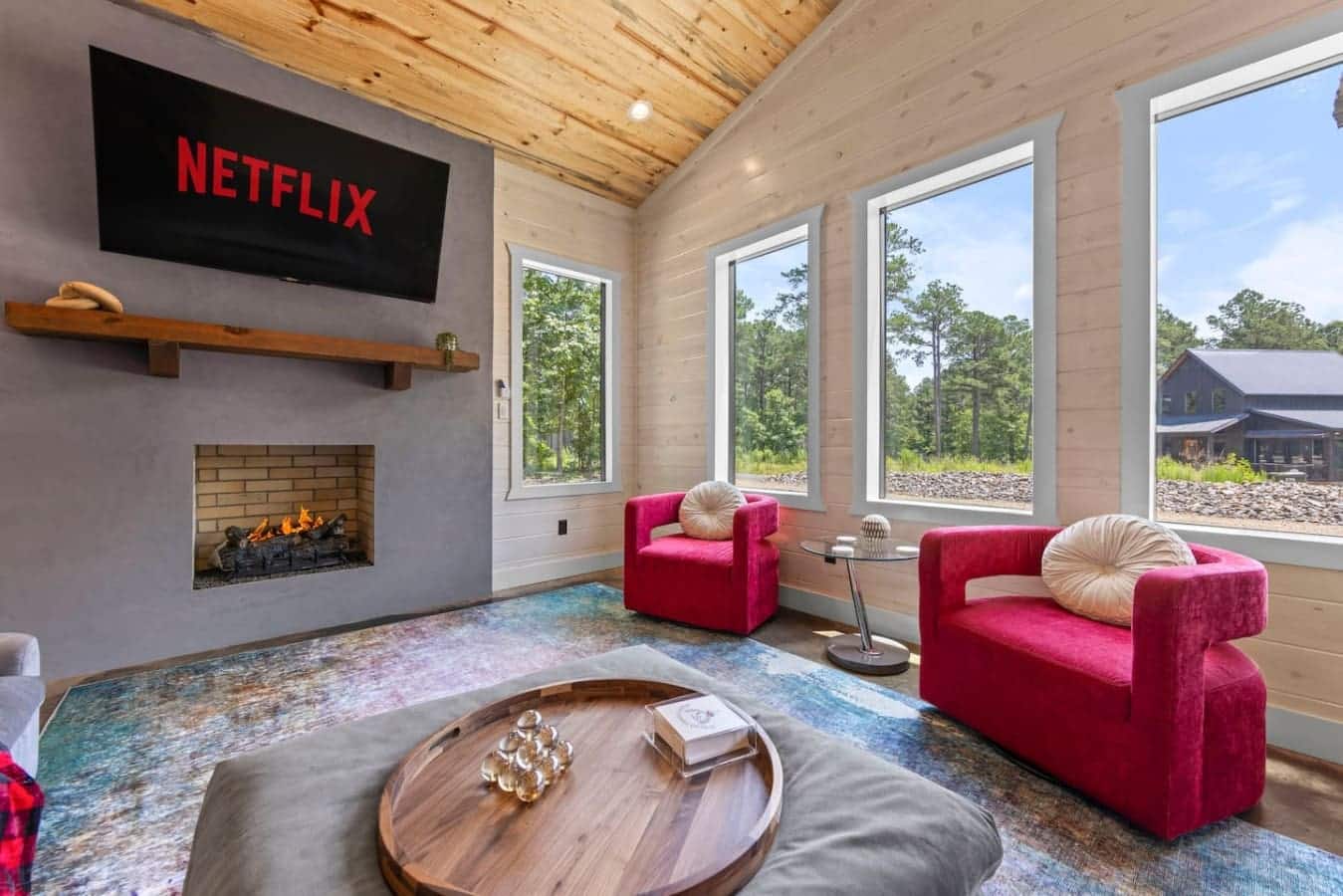 Cozy fires, vibrant vibes 🔥✨ Kick back in style with bold pops of color, floor-to-ceiling views, and your favorite Netflix binge. Comfort just found its aesthetic."