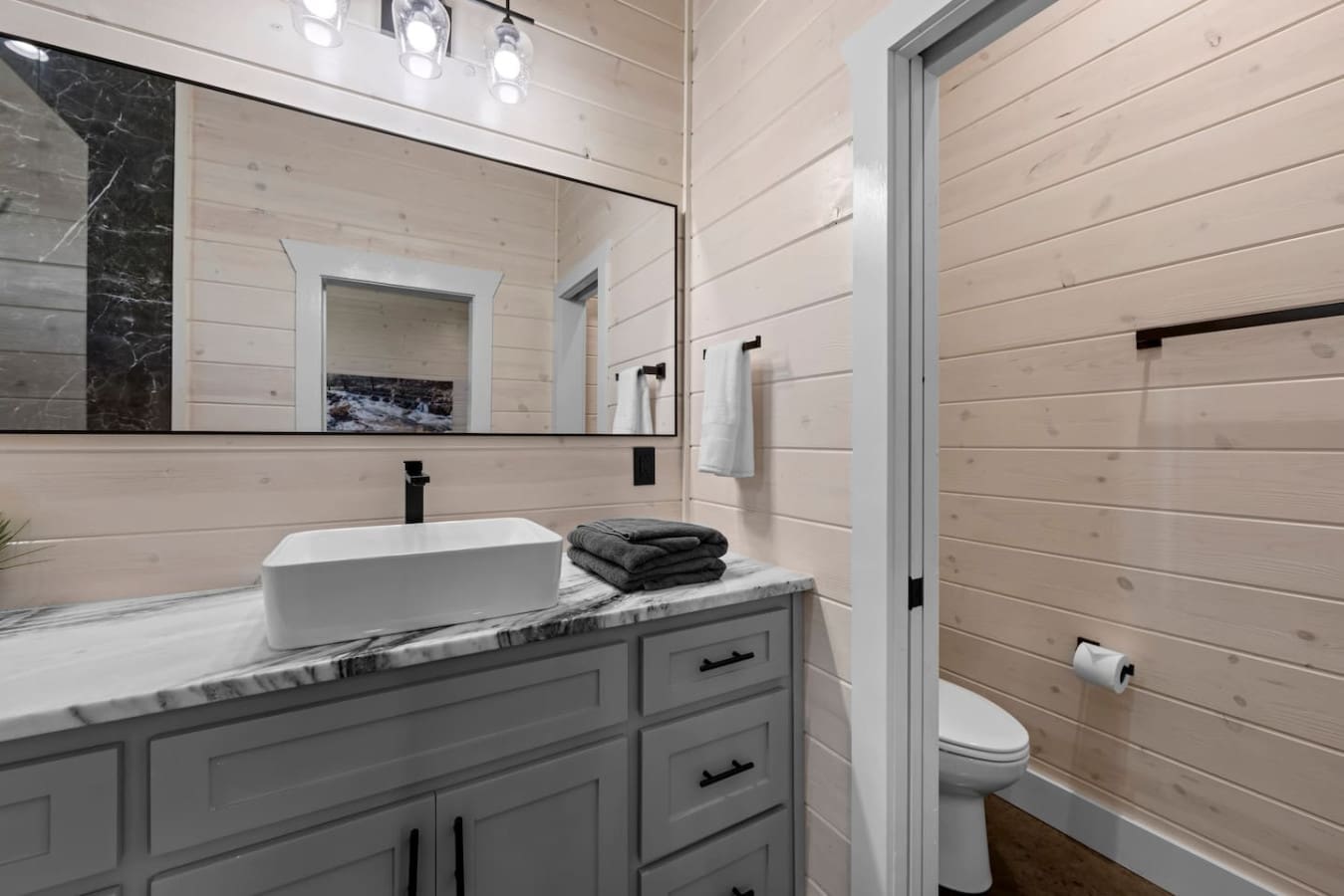Refresh and recharge in style with marble finishes and cozy cabin vibes.