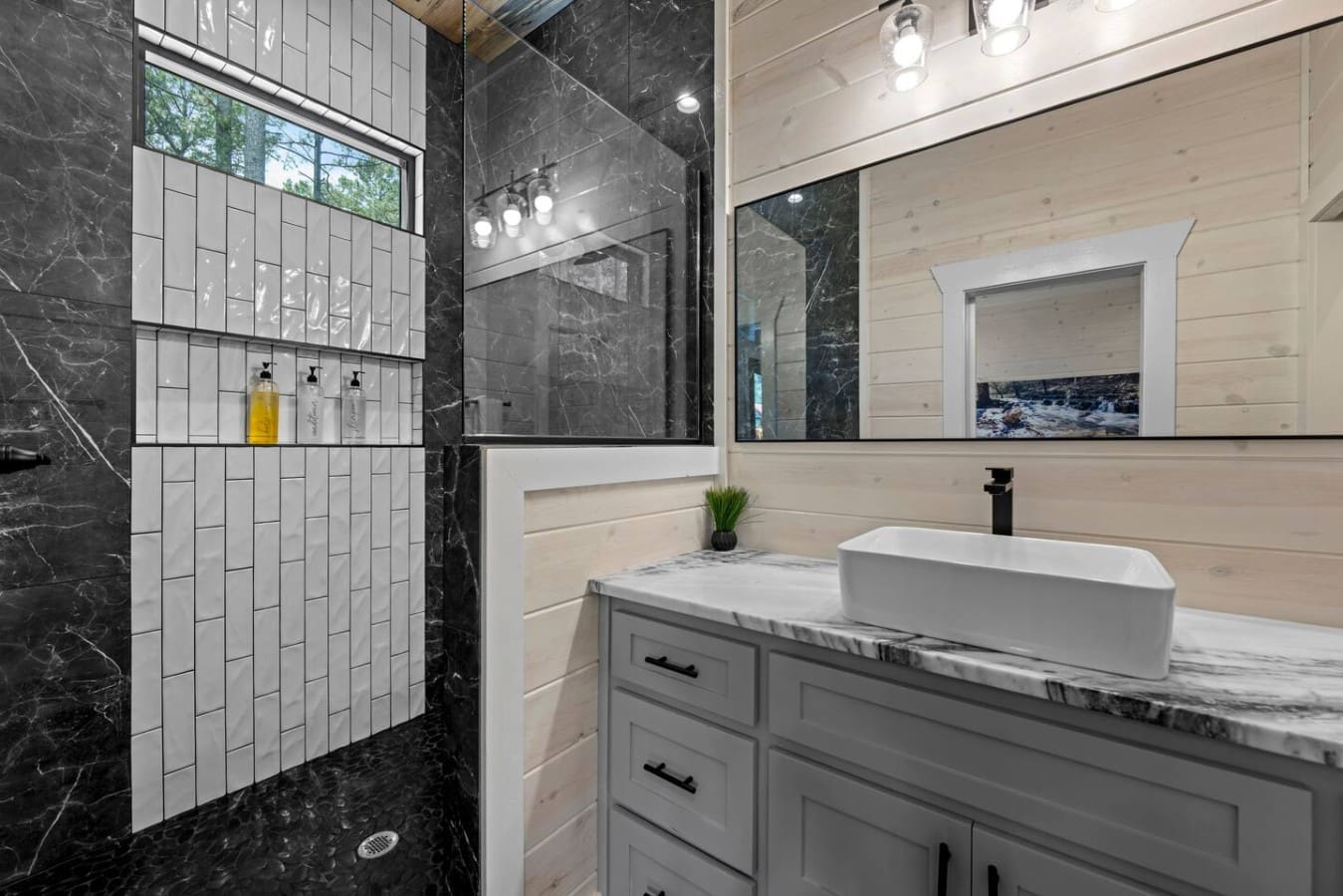 Modern elegance meets rustic charm in this rainfall shower oasis, designed for total relaxation.