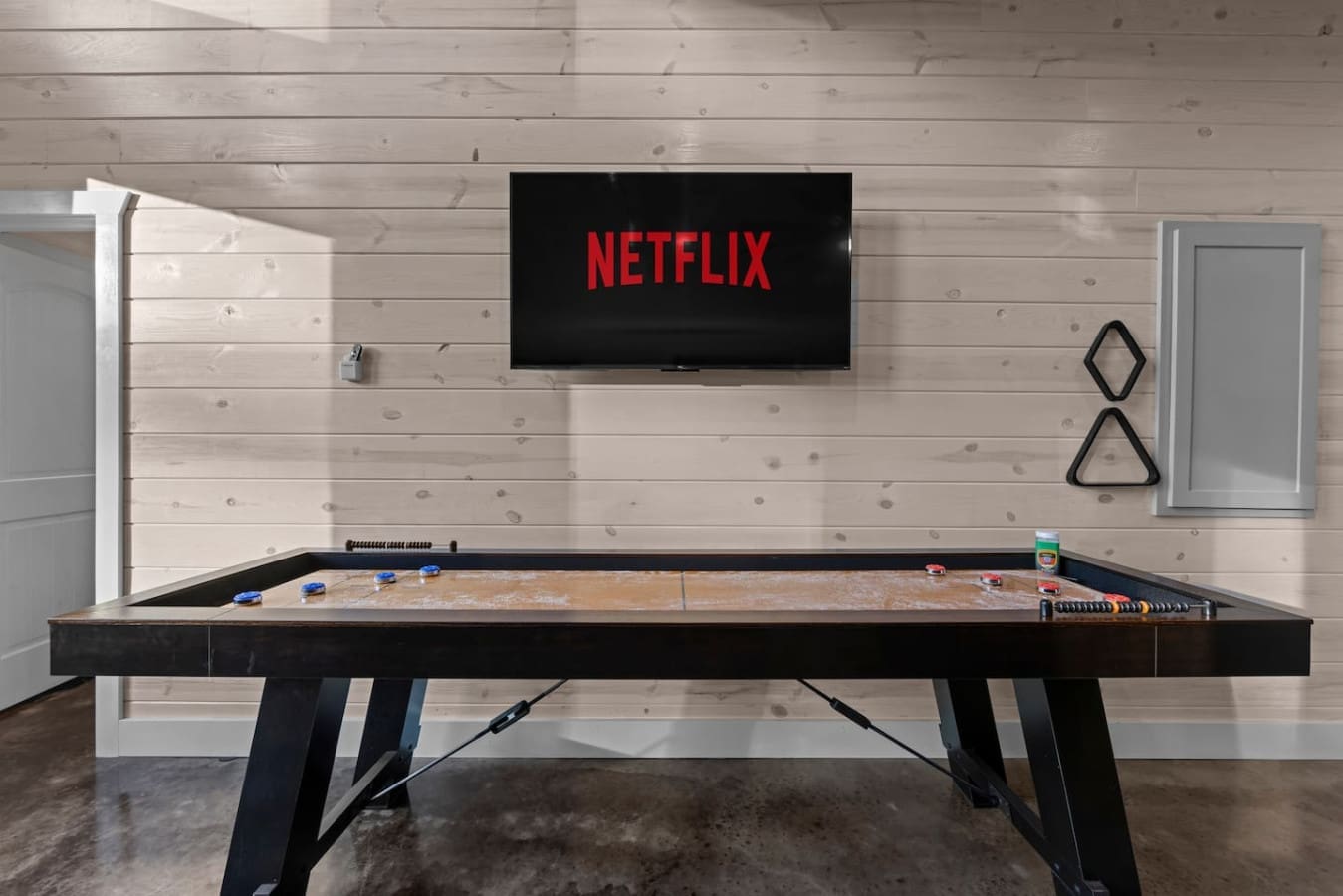 Now we’re talking—shuffleboard and Netflix? That’s a combo made for serious relaxation. 🎯📺 Whether it’s game time or show time, this space is all set!