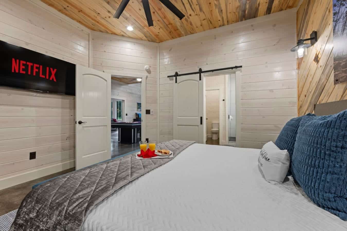Game room next door, Netflix in bed — good luck ever leaving this room.