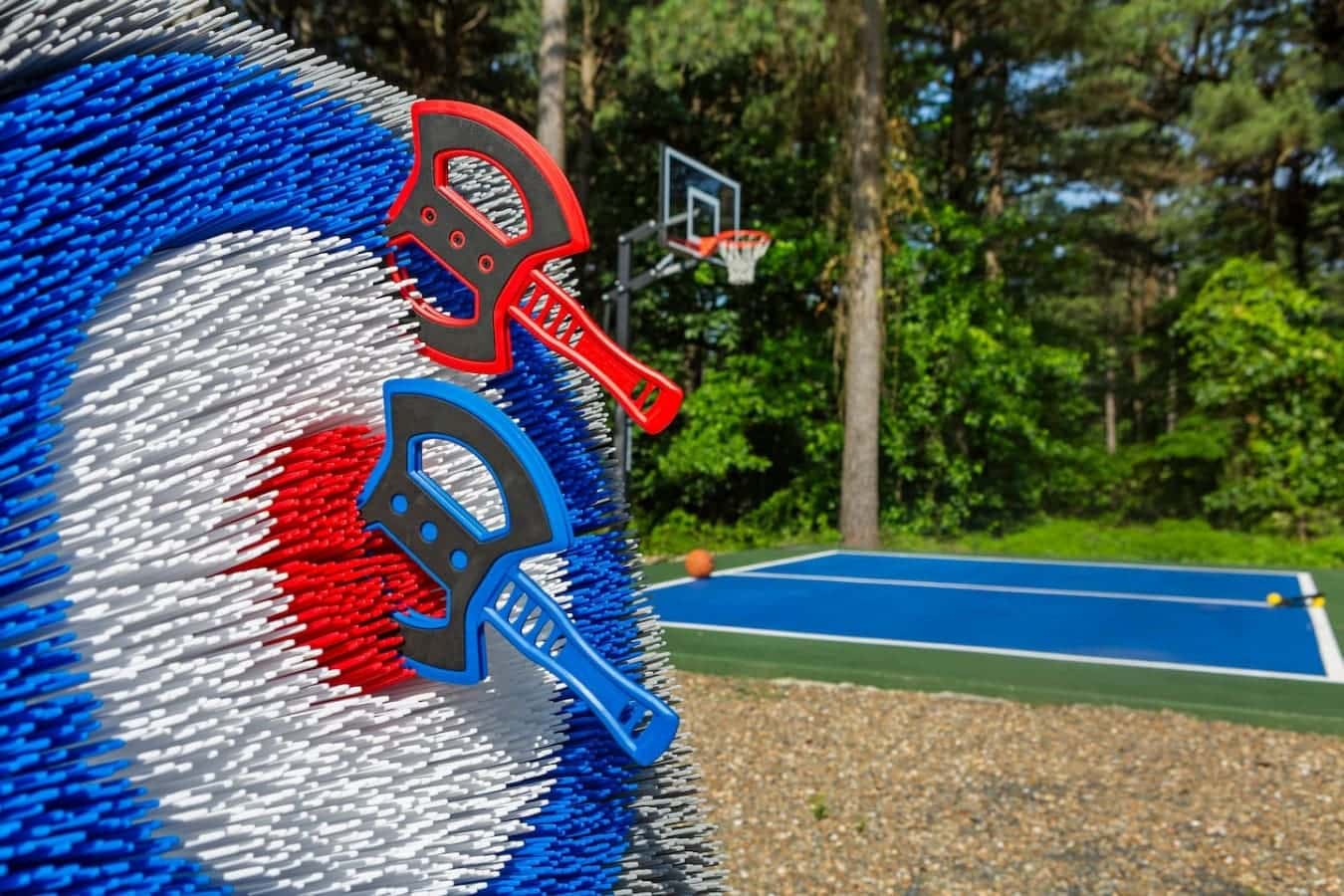 A little friendly competition? Axe throwing, basketball, and paddle — all in one backyard