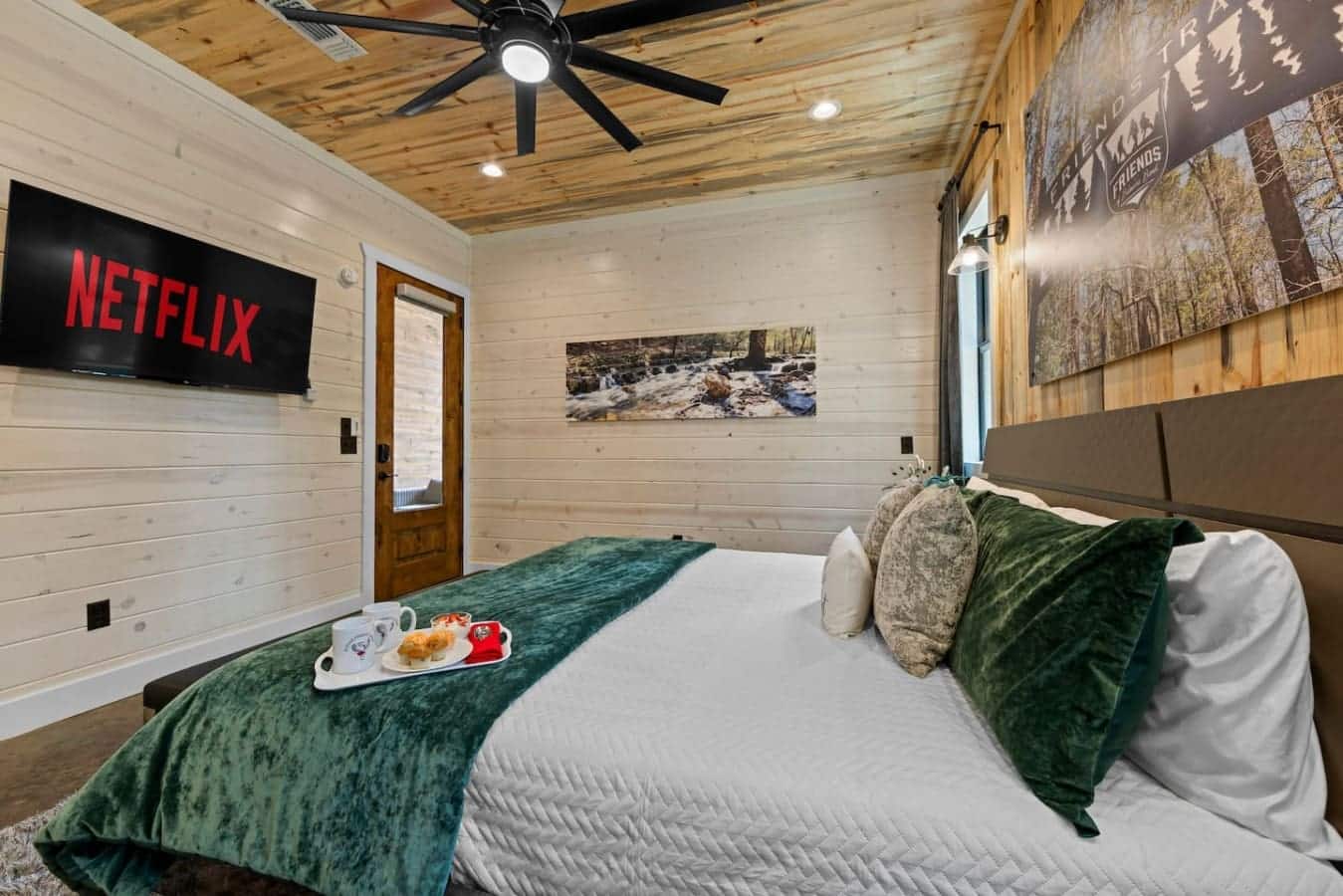Snuggle up with plush pillows, forest views, and your favorite Netflix binge — the ultimate cabin night in.