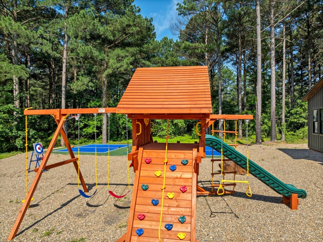Playtime paradise in the pines—swings, slides, and sunshine!