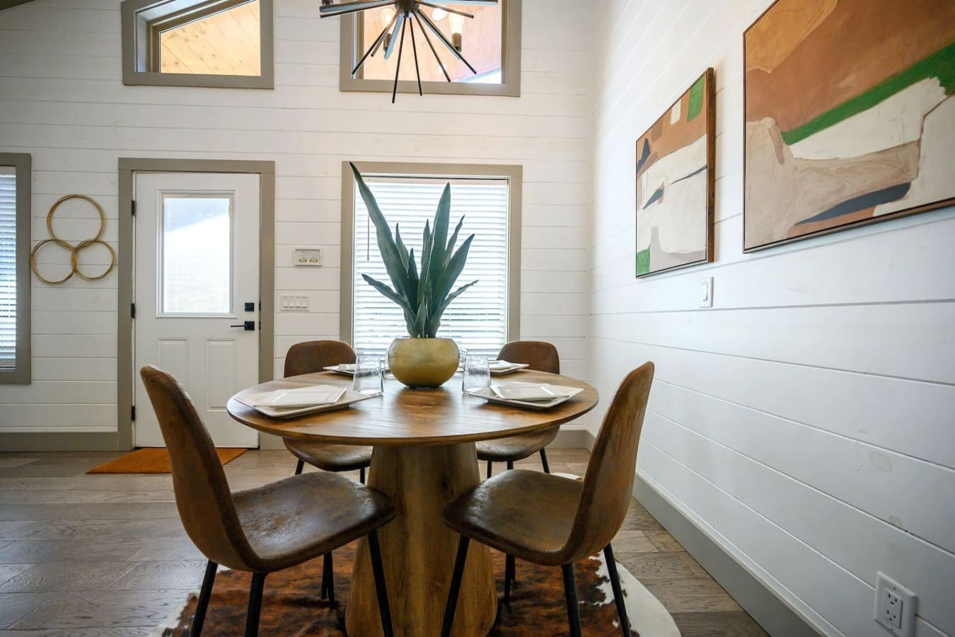This round wood table is basically begging you to pull up a chair and stay awhile.
