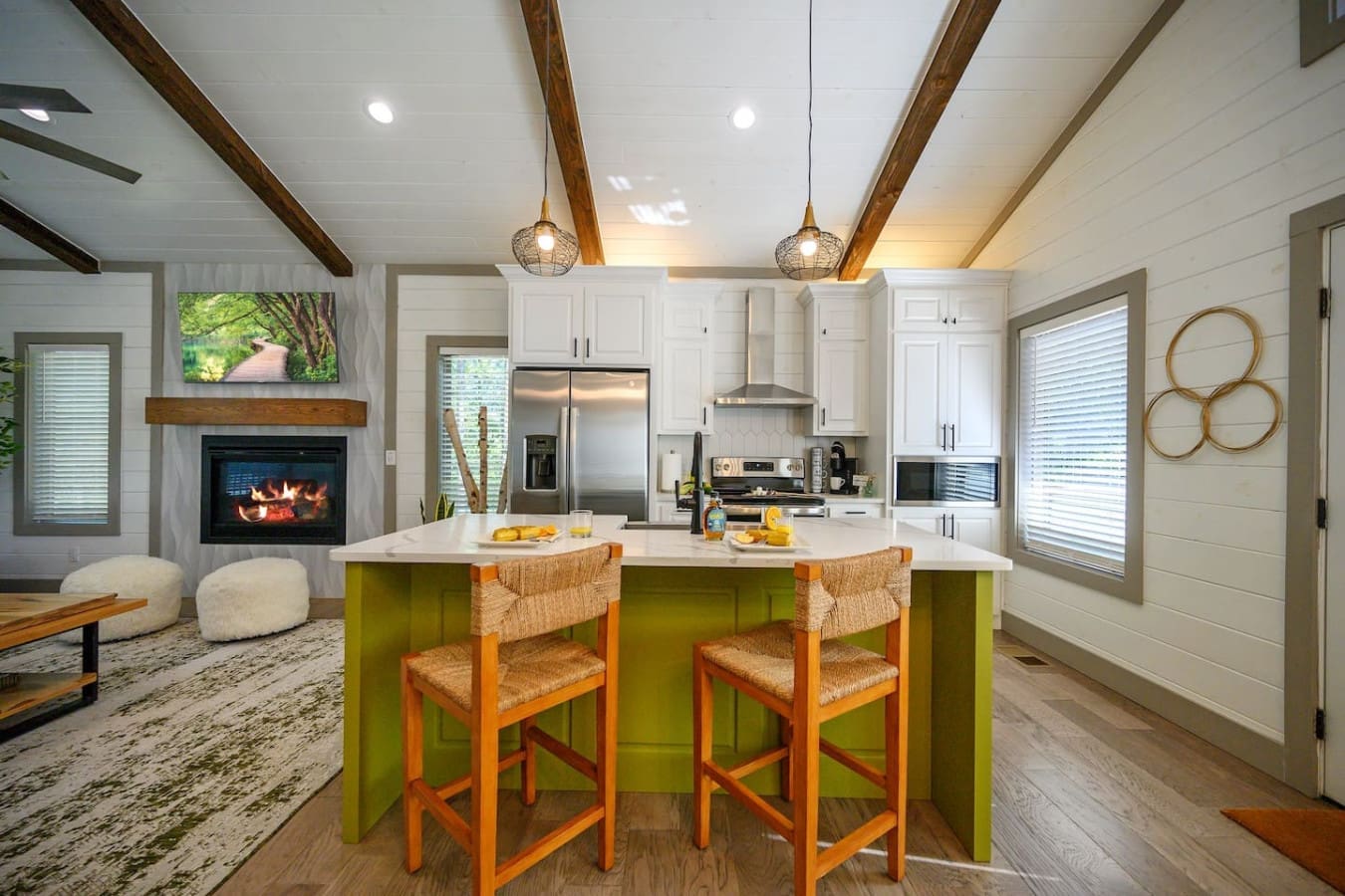 This kitchen's got serious green-island energy if you're the type to actually hang out while someone's cooking instead of hiding in another room.