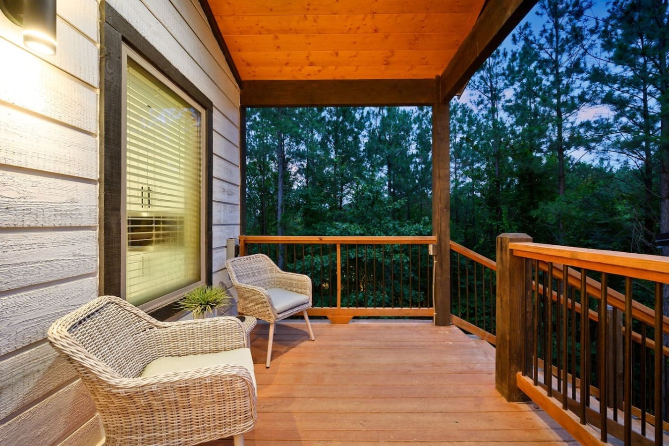 This covered deck is basically your own private viewing platform where the woods become your living room backdrop.