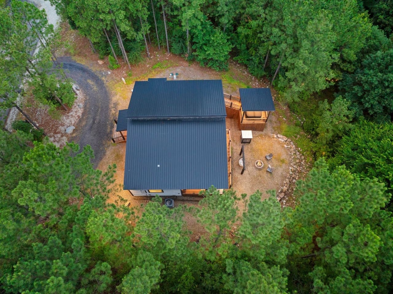 You'll feel like you've stepped into your own private world the moment you pull up to this cozy cabin surrounded by towering trees.