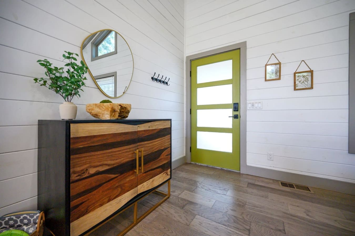 Welcome home to this bright, airy entryway where that pop of green instantly tells you this place has personality.