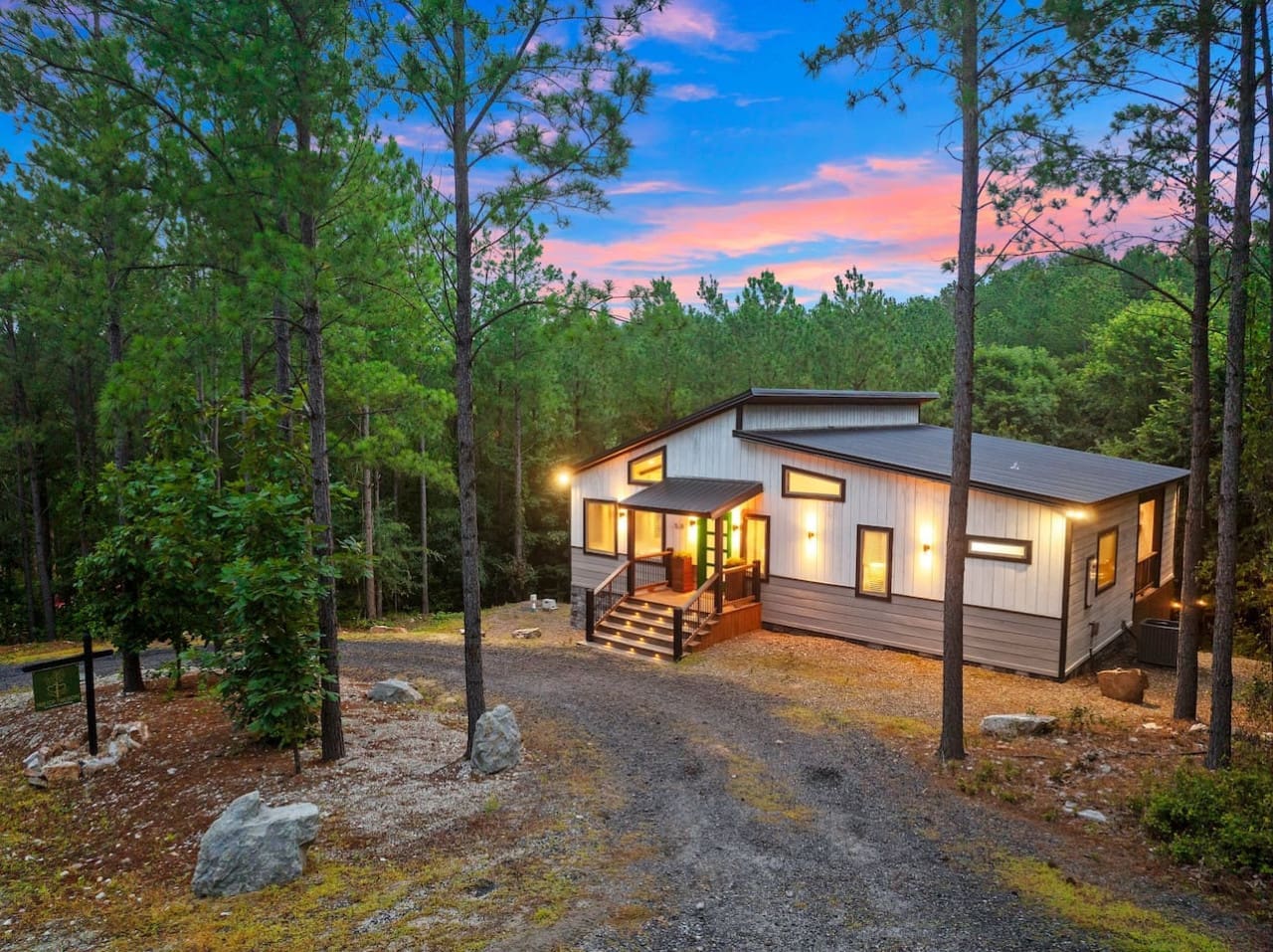 This cozy cabin is basically your own little hideaway tucked between towering pines—no cell service required.
