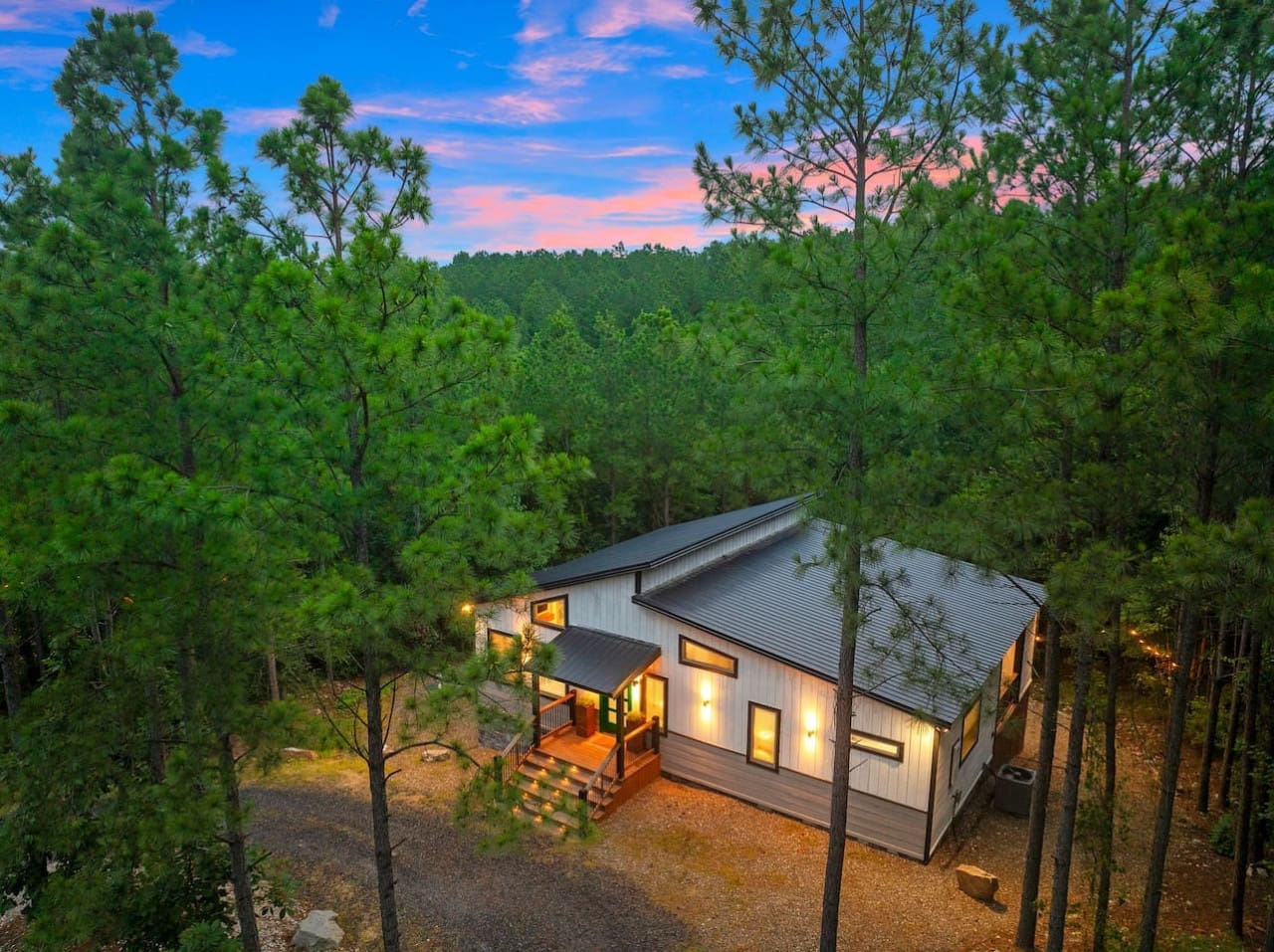 This sleek cabin is literally what happens when modern design decides to chill out under the trees.