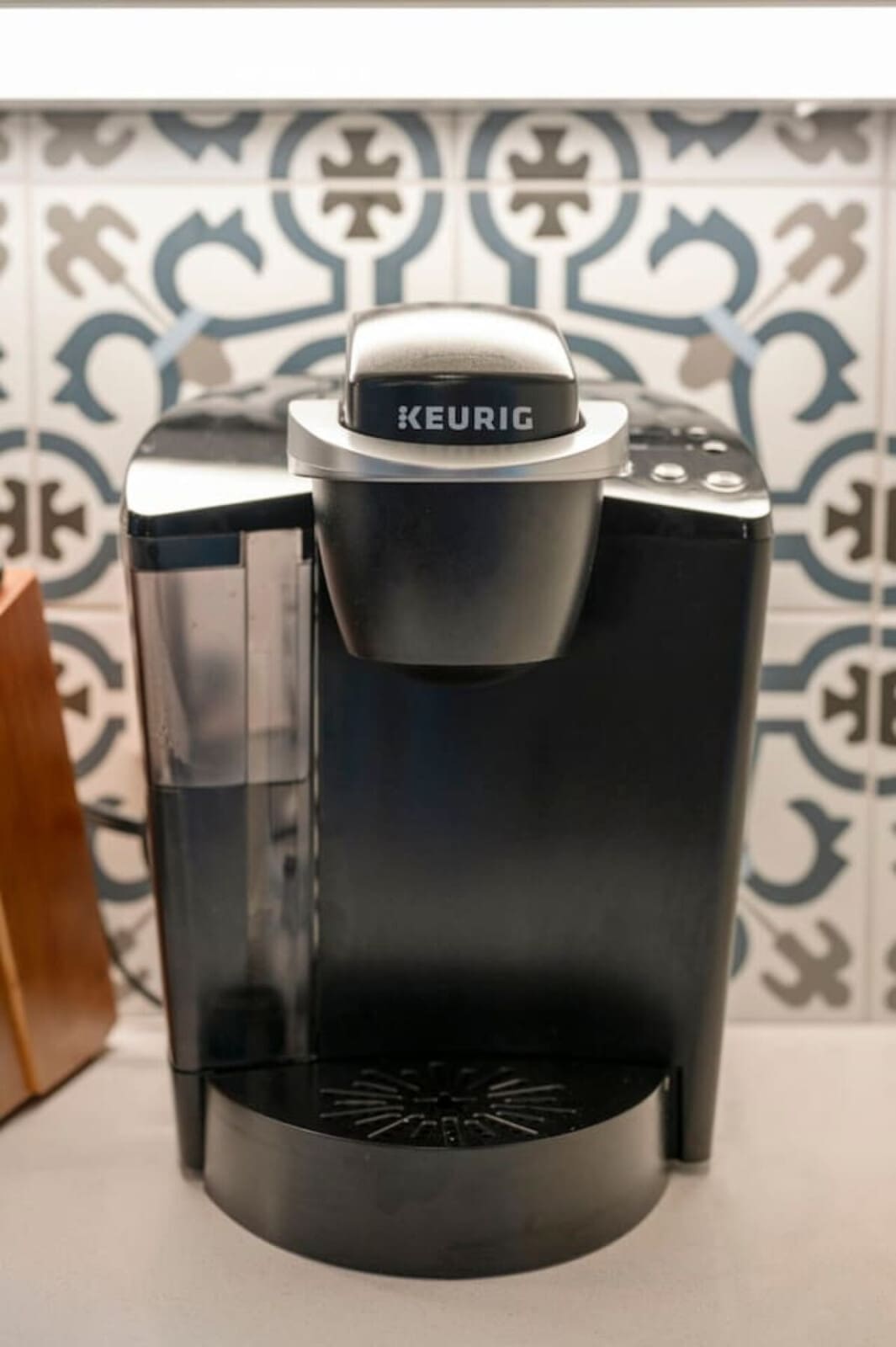 The Keurig station tucked into this kitchen corner is basically the kind of "good morning" setup that makes you feel taken care of before you've even had your coffee.