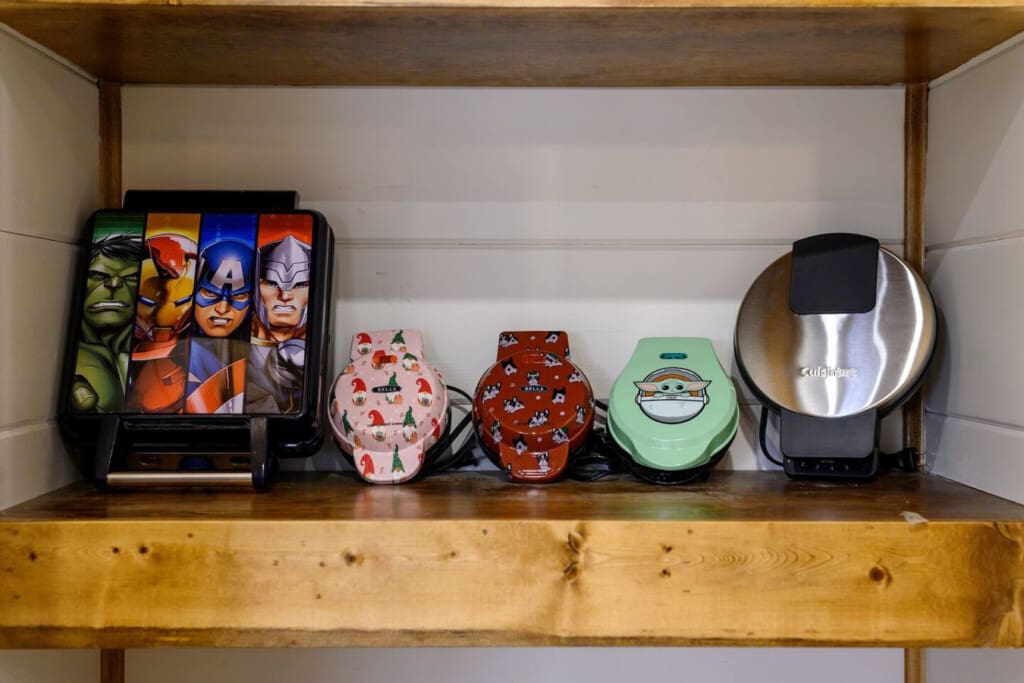 Your favorite kitchen gadgets and waffle makers have their own cozy shelf ready to help you whip up cabin breakfasts.