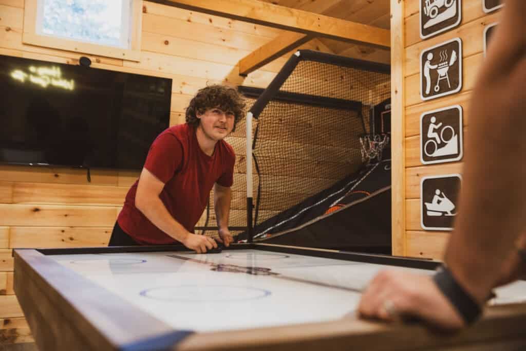 Cabin game room: where friendships are tested and fun is guaranteed.