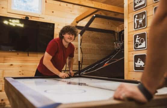 Cabin game room: where friendships are tested and fun is guaranteed.