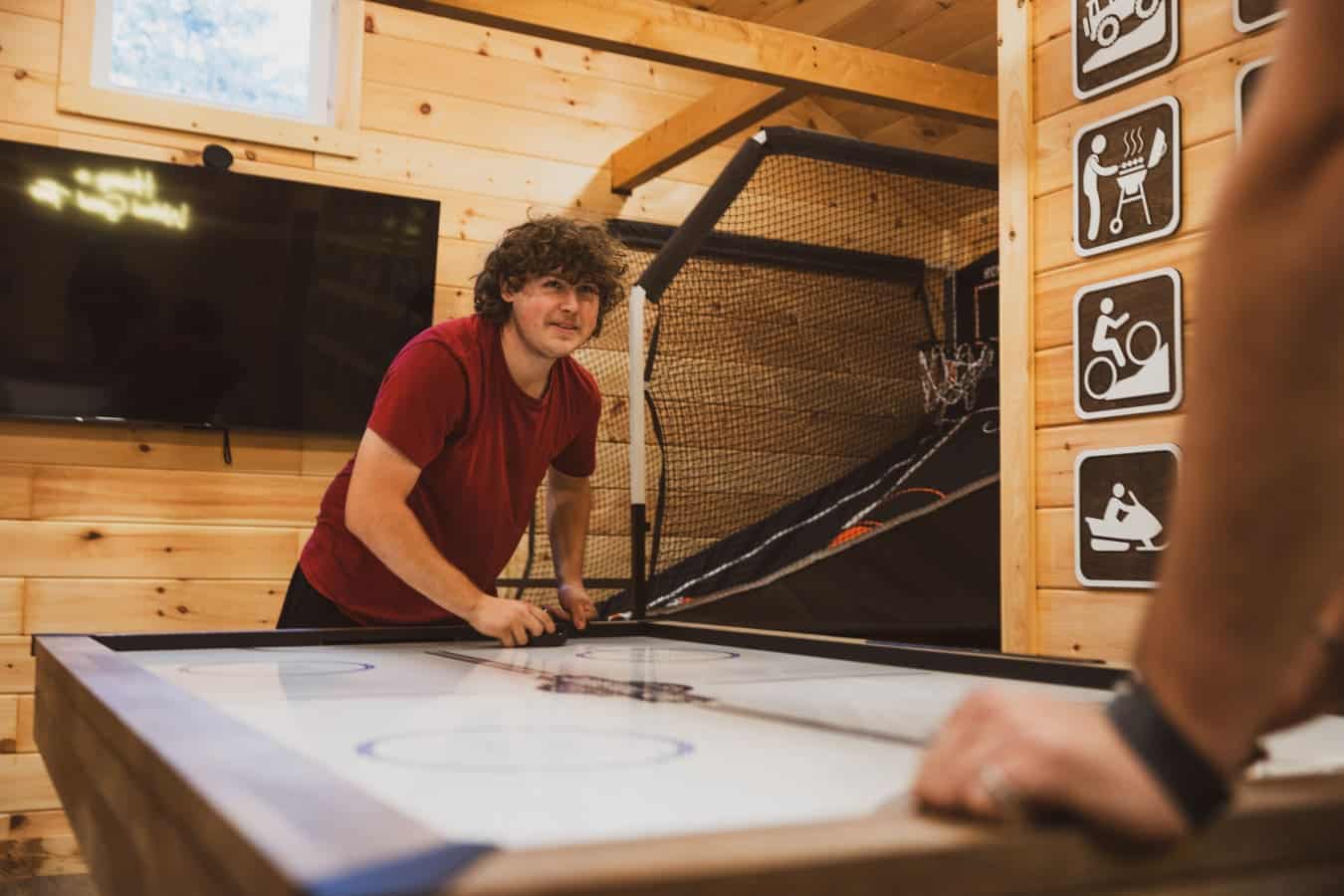 Cabin game room: where friendships are tested and fun is guaranteed.