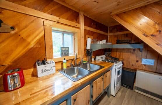 Cook your favorite meals while enjoying the charm of natural wood all around.