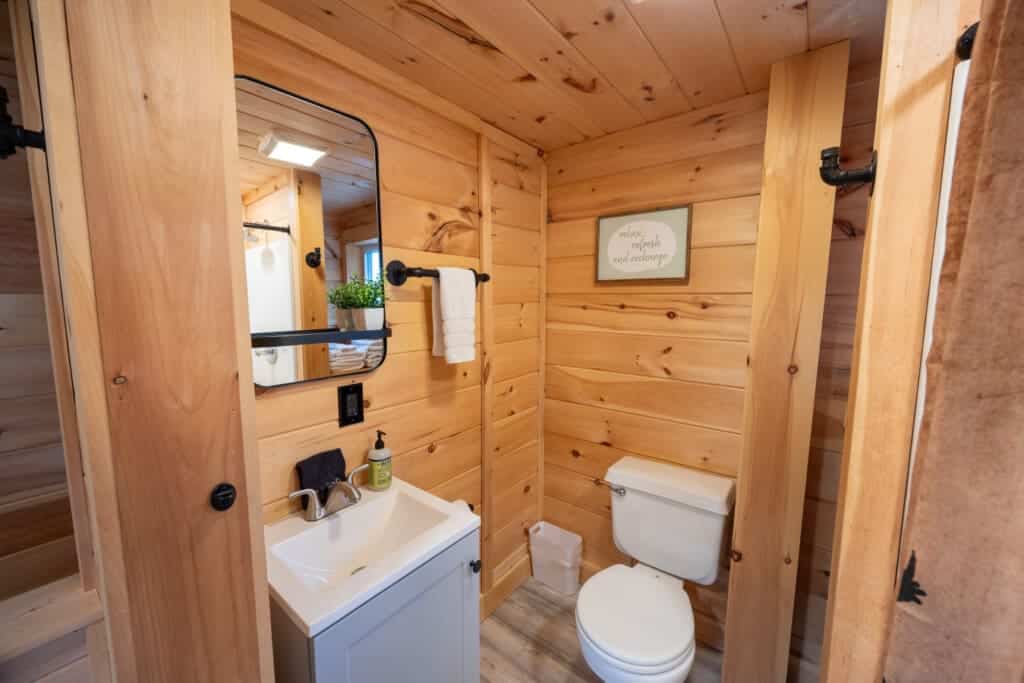 Rustic comfort meets modern simplicity in this inviting bathroom retreat.