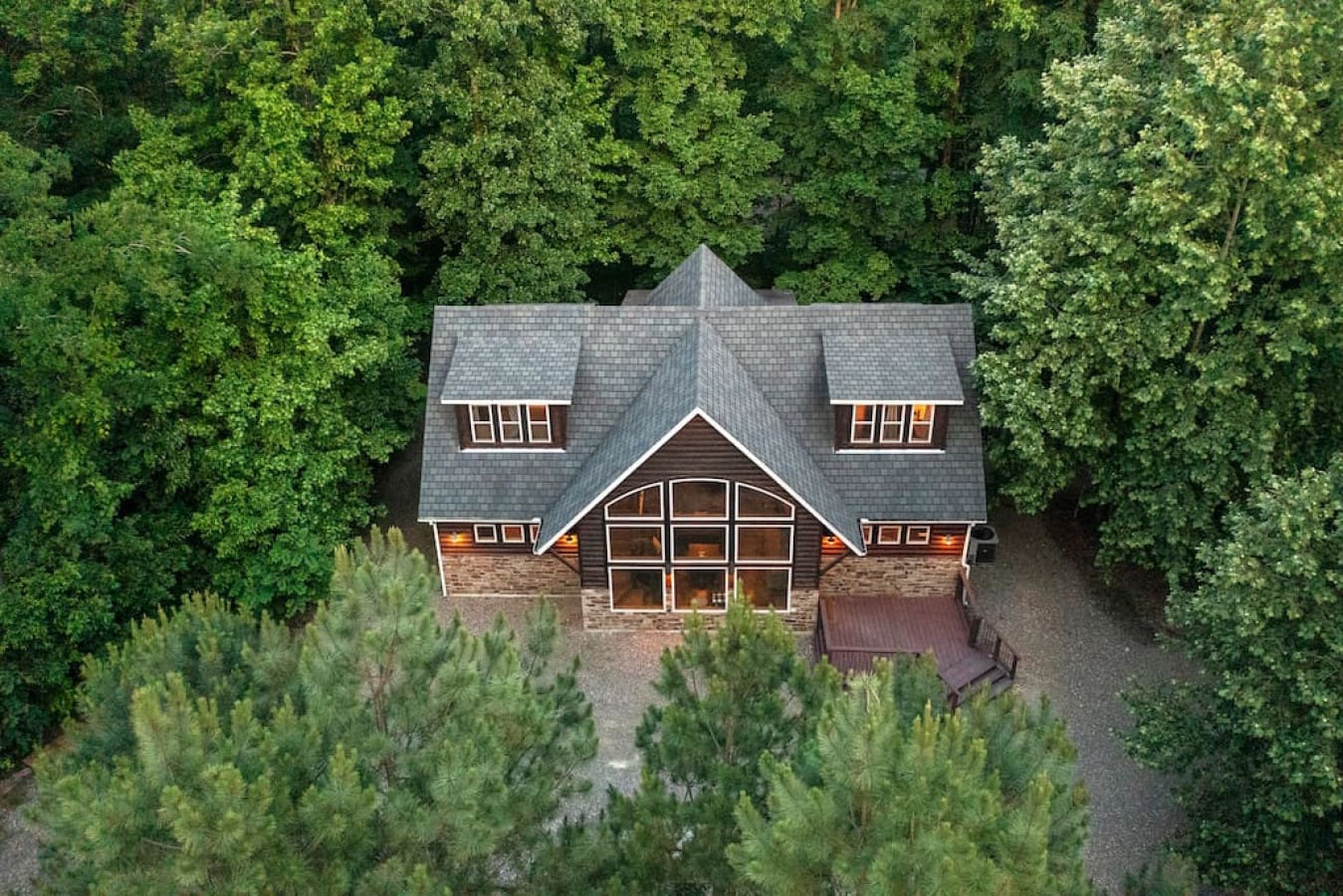 rom above, a rustic haven surrounded by wilderness.