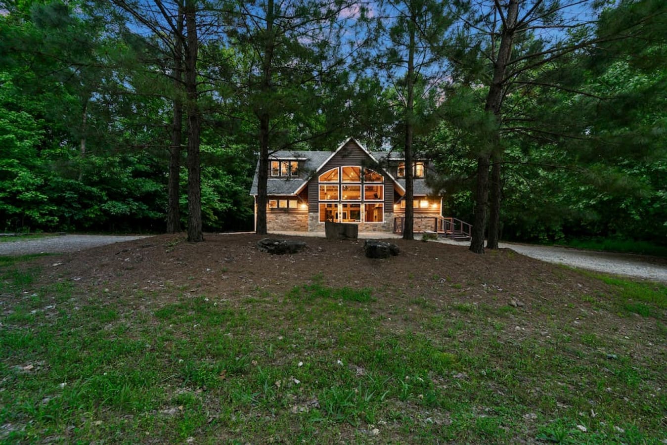 Embrace tranquility with our picturesque cabin front view.