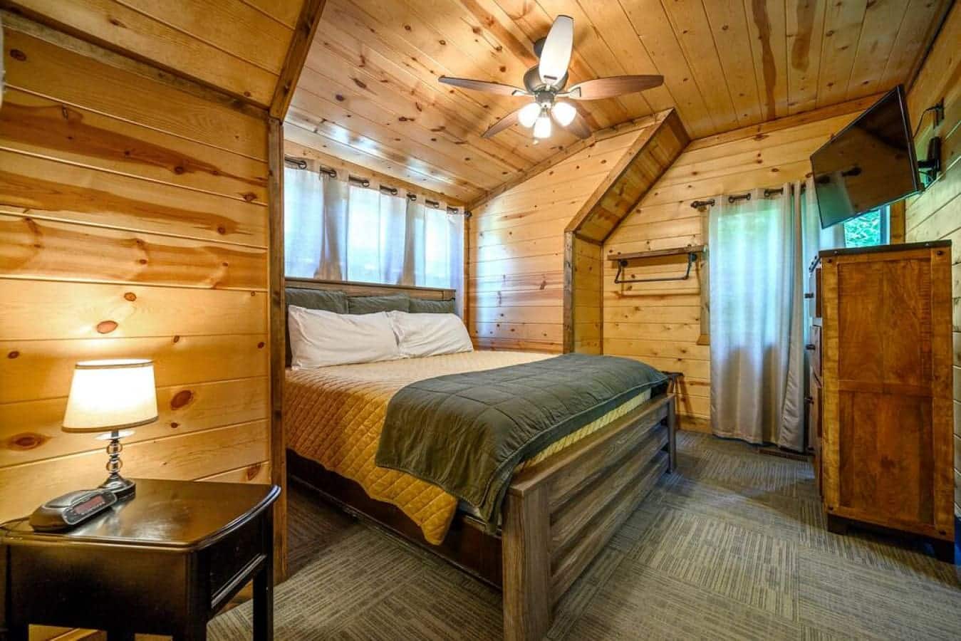 Savor the cozy ambiance of this cabin bedroom, a retreat within a retreat, where every corner invites you to unwind and embrace the quiet beauty of simplicity.