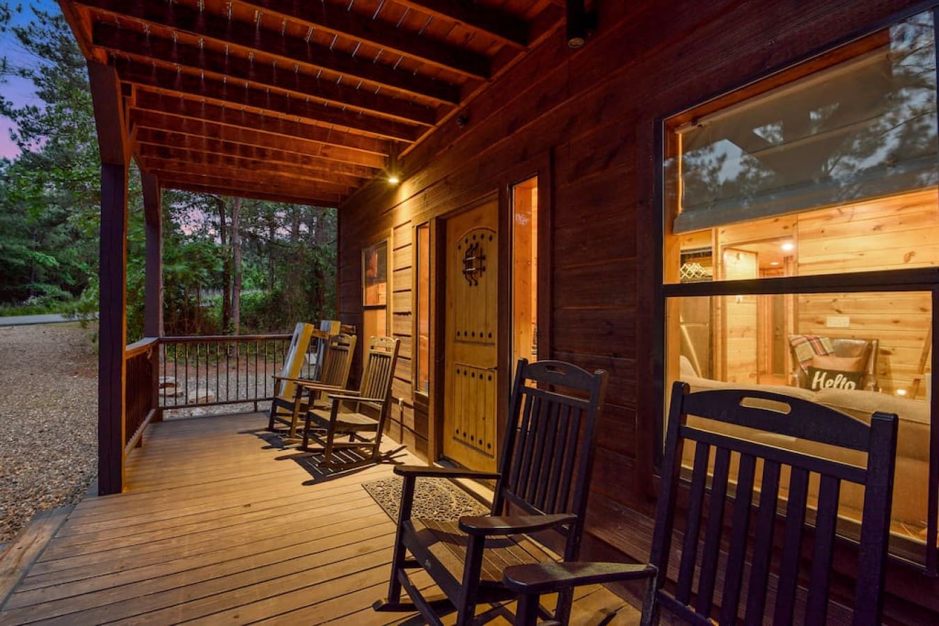 Rock away your worries on our cabin's cozy front porch.