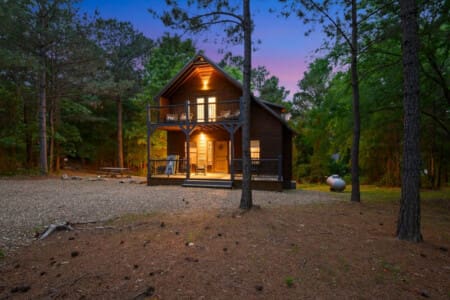 Step into serenity: our cabin's front view awaits.