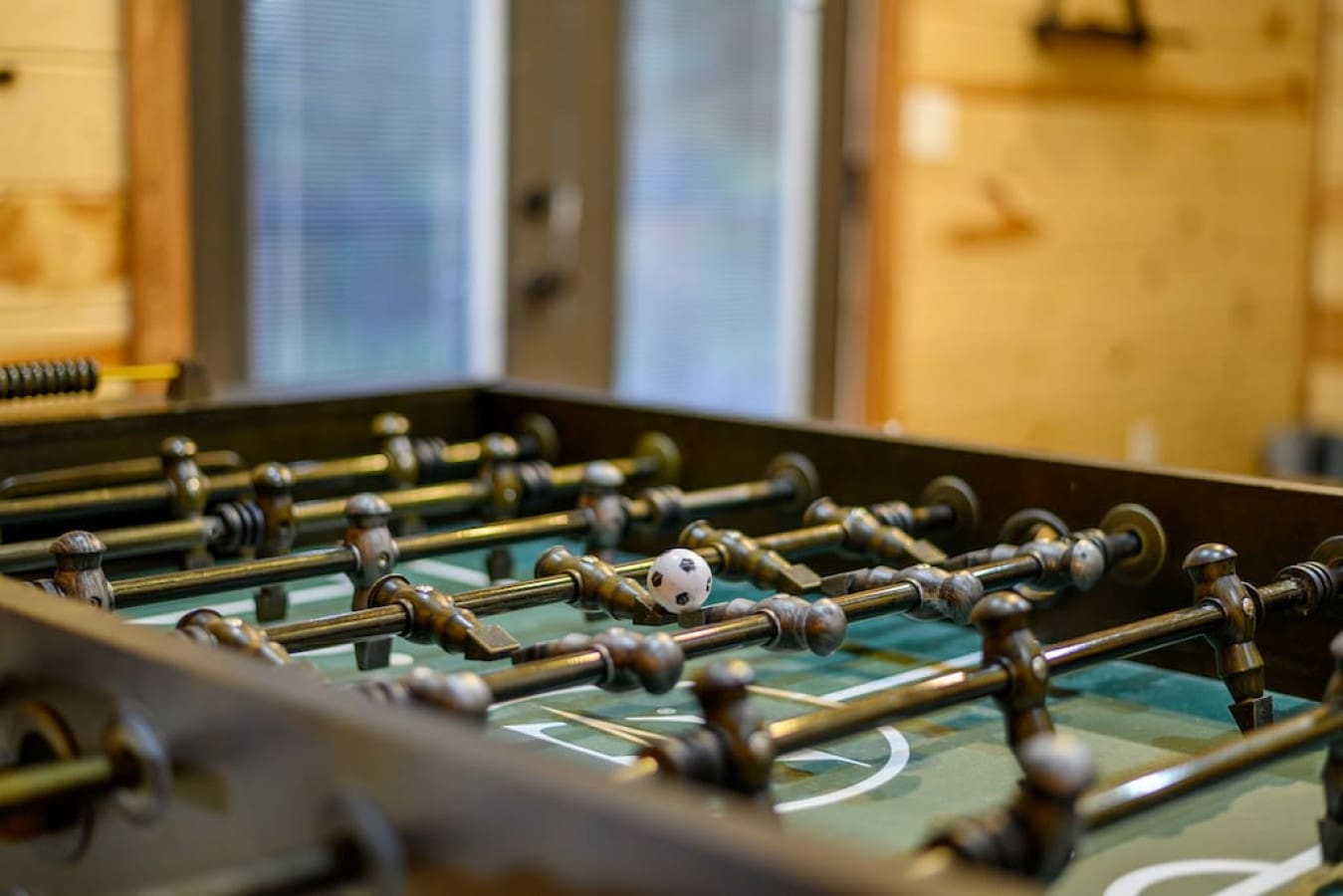 Where competition meets camaraderie: our cabin foosball haven.