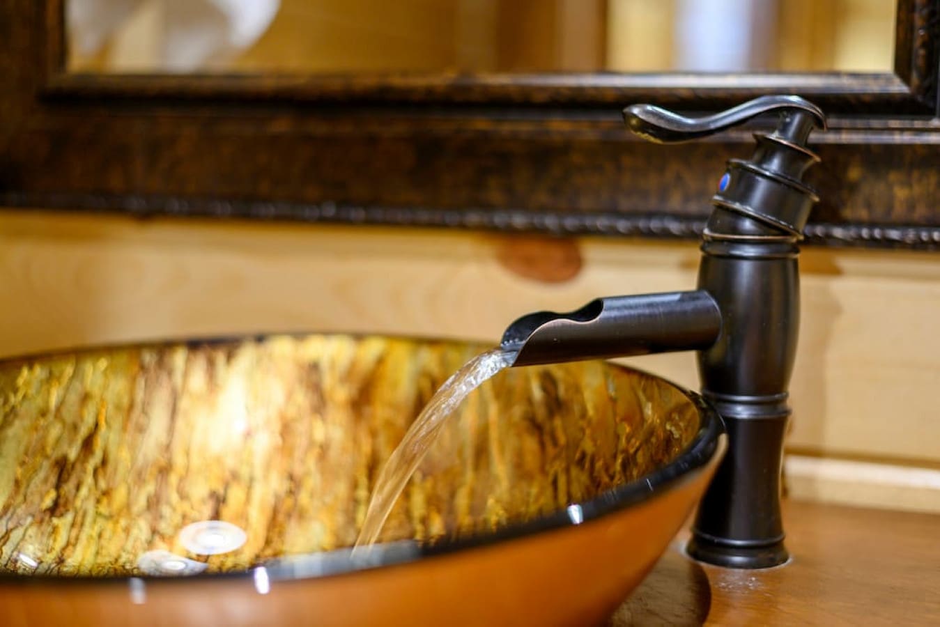 Crafted elegance: Our cabin's bathroom faucet brings sophistication to rustic charm.