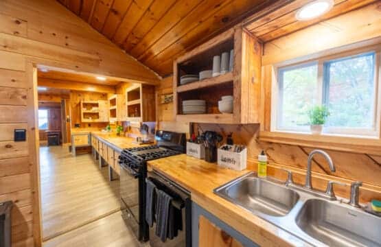 Rustic textures, open shelving, and a view that steals the show.