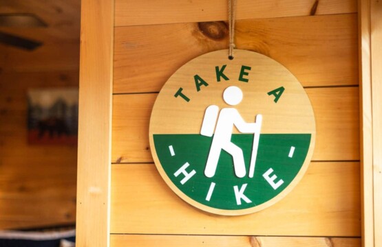 This sign’s got the right idea: adventure awaits just outside the door.