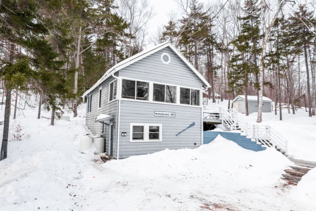 Snow-kissed serenity surrounds the cabin, inviting you to embrace the quiet beauty of winter.