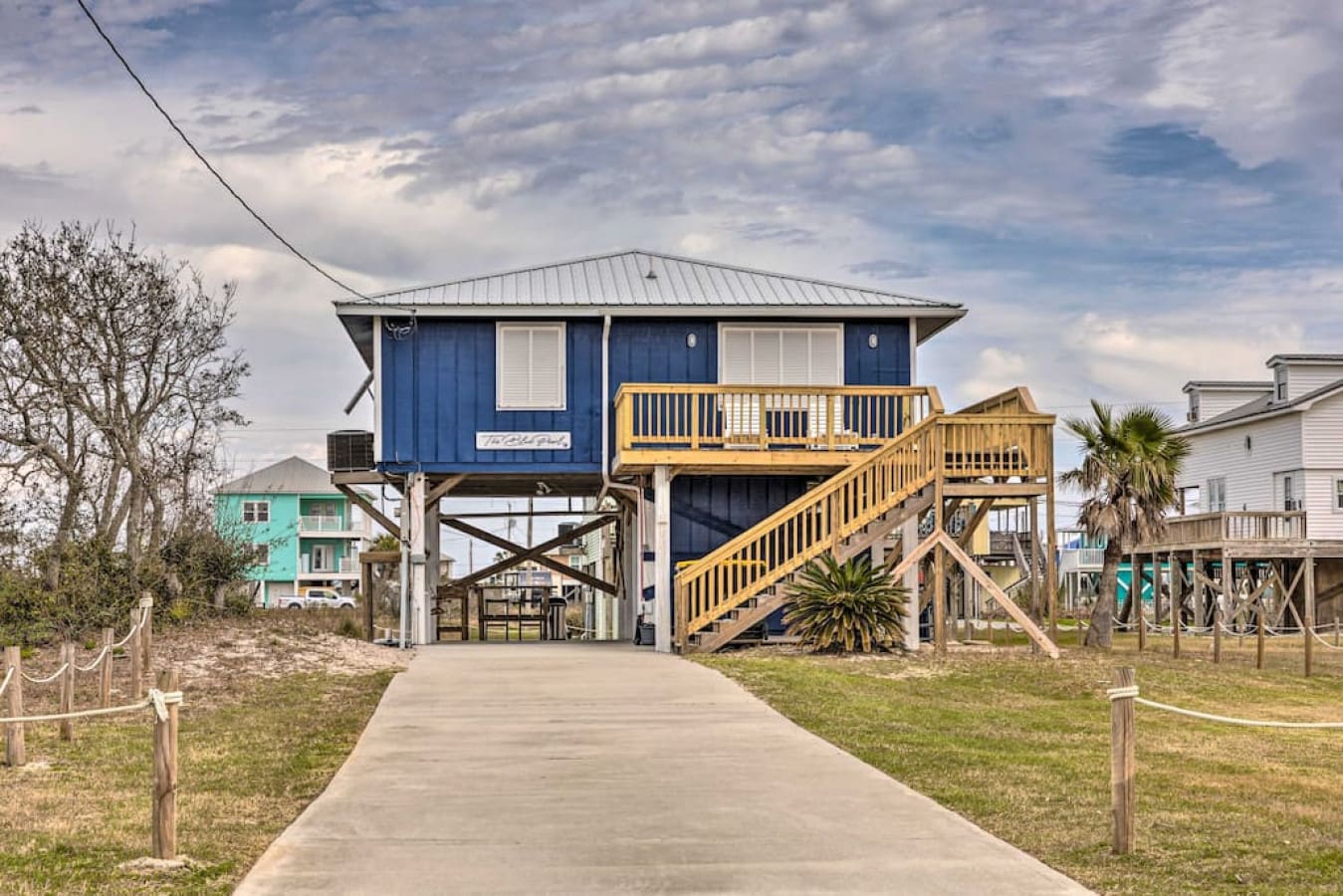 This cheerful blue hideaway with its bright yellow deck is basically begging you to kick back and forget what day it is.