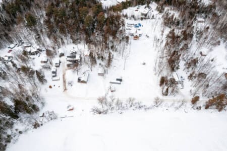 Nothing beats a frozen lake surrounded by towering pines—it's the kind of peaceful, snowy Maine scene that makes you feel a million miles away from everything.