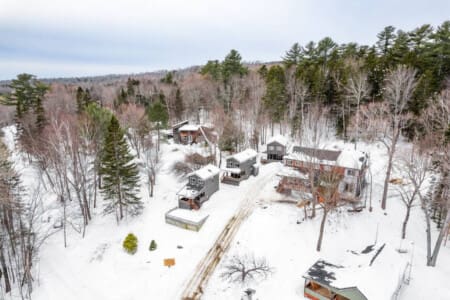 Five cozy cabins nestled in the Maine woods with private lake access—the perfect setup for a group getaway where everyone gets their own space but can still gather together.