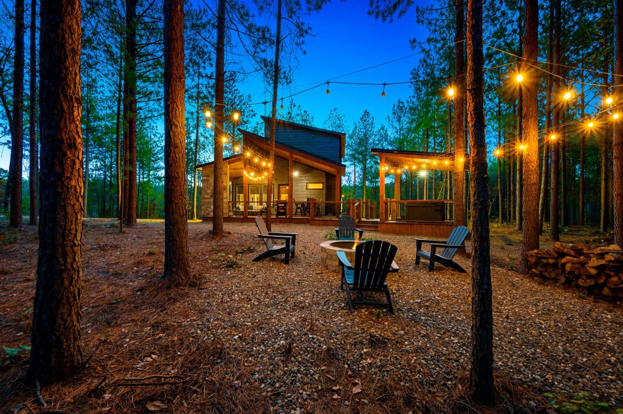 Ambiance aglow: string lights and fire pit magic.