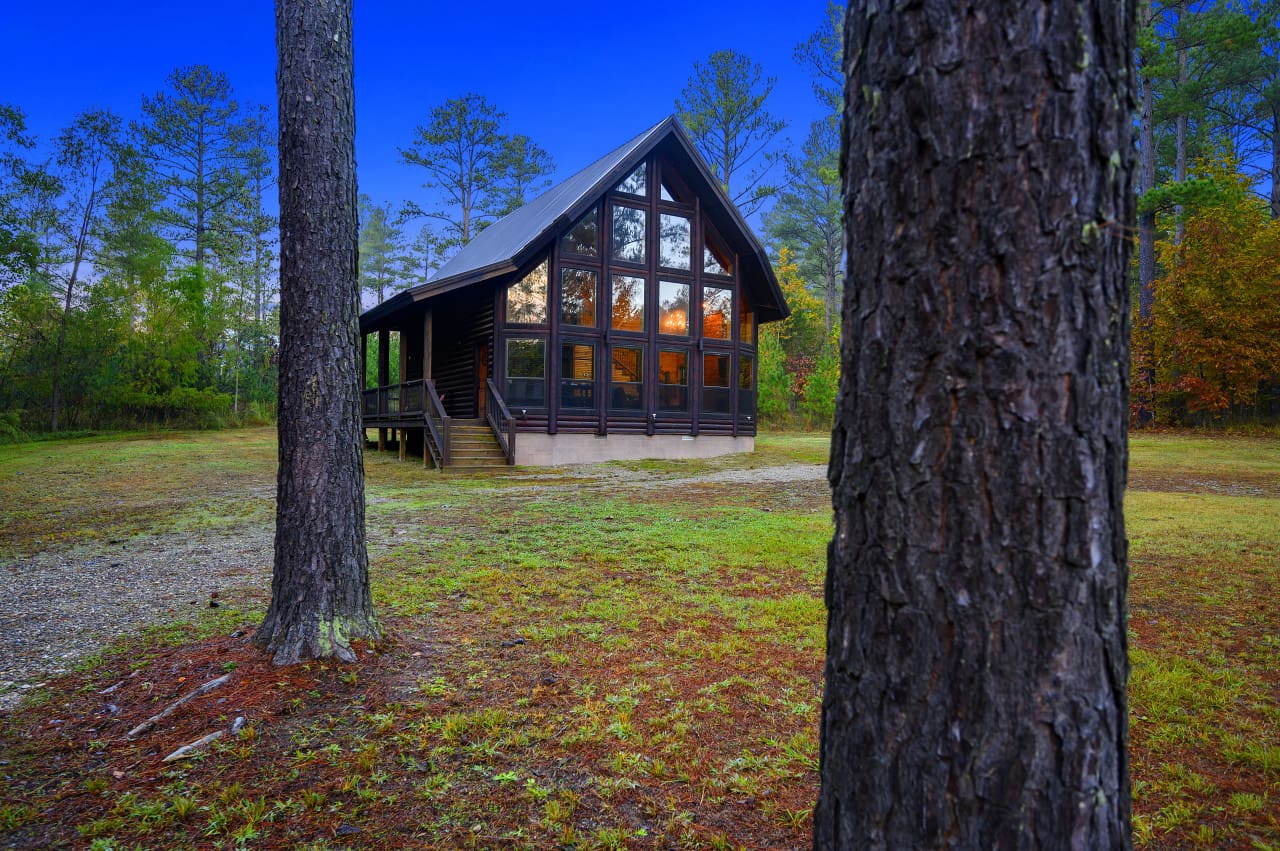 Whispering pines guard this rustic retreat.